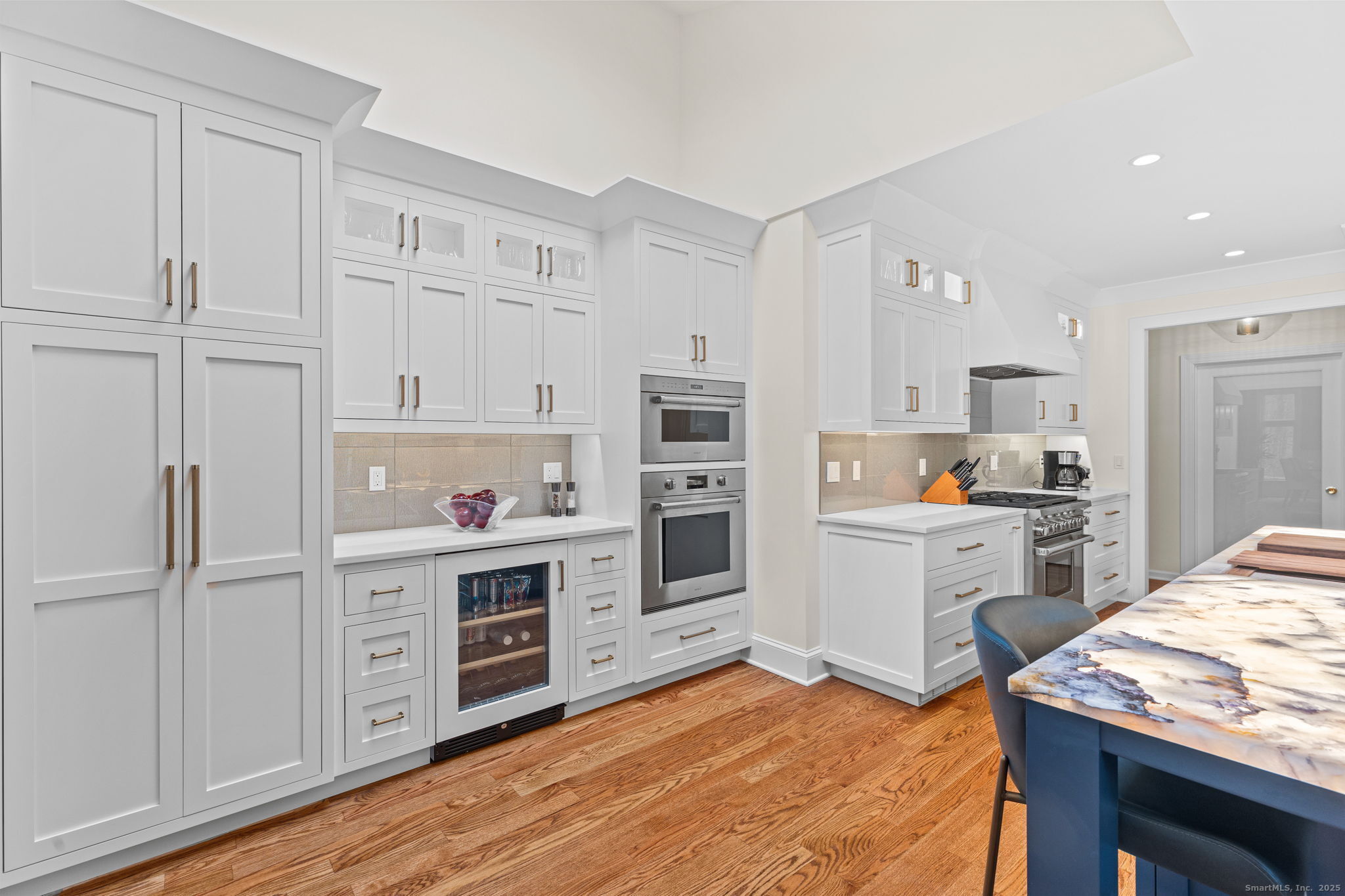 40 Hull Place Ridgefield, CT 06877 - Photo 12 of 40 a kitchen with a refrigerator cabinets and wooden floor