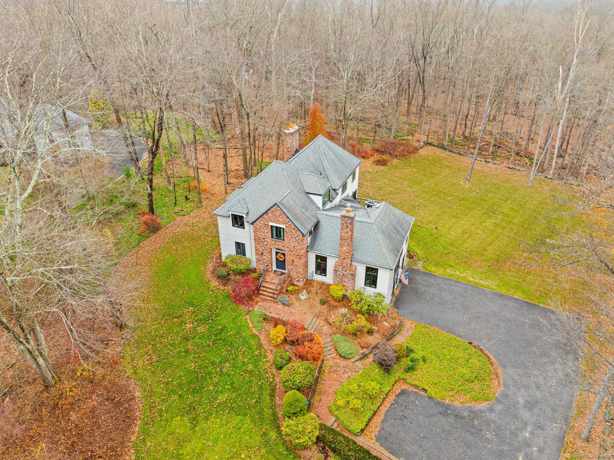 40 Hull Place Ridgefield, CT 06877 - Photo 2 of 40 a view of a swimming pool with an outdoor space and seating area