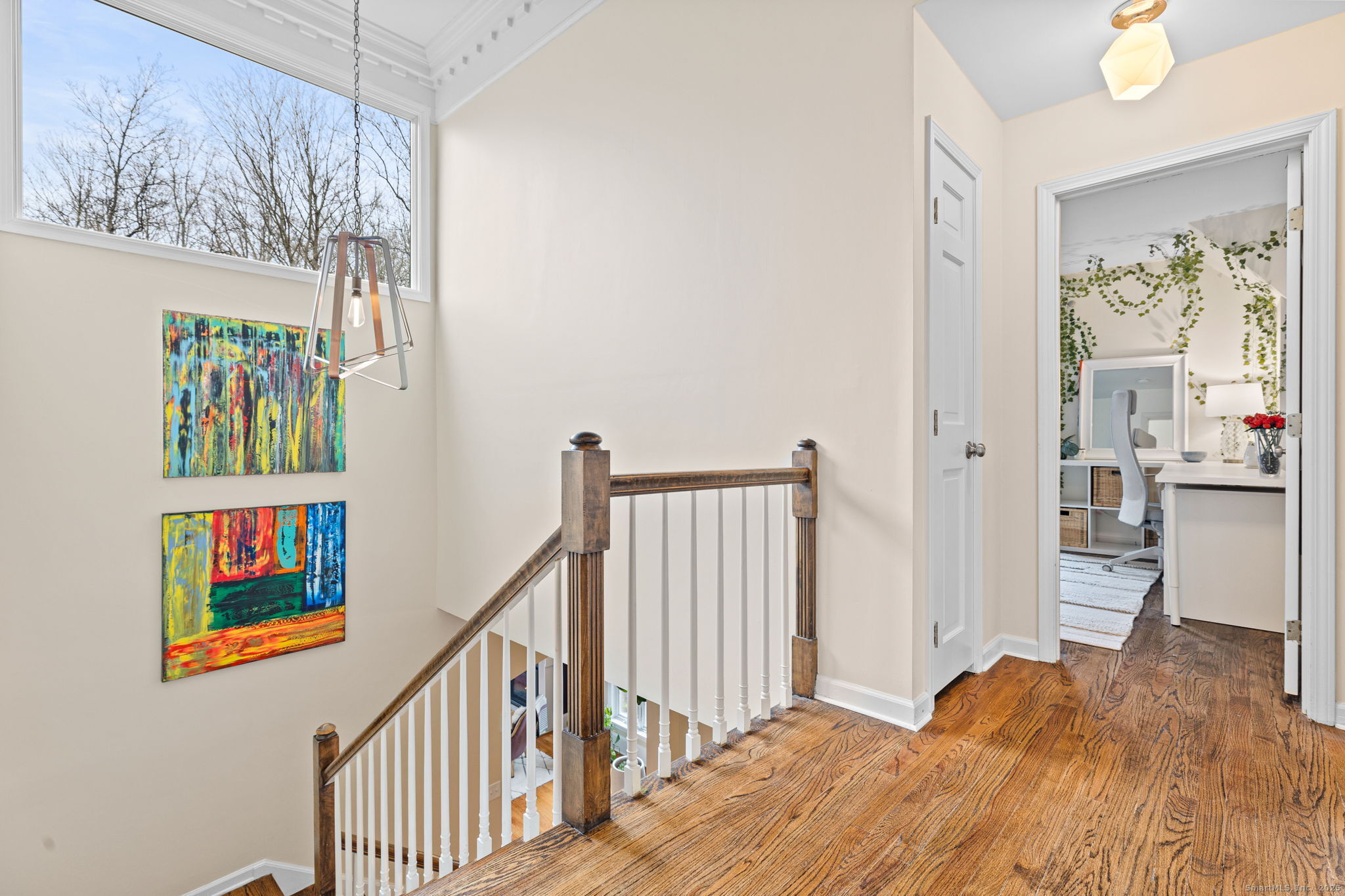 40 Hull Place Ridgefield, CT 06877 - Photo 33 of 40 a view of a bedroom with wooden floor and windows