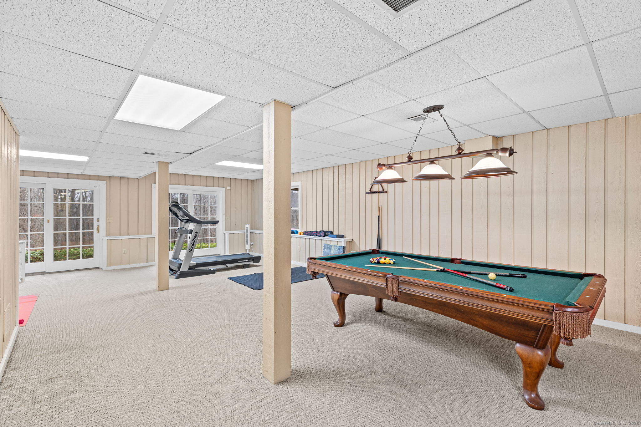 40 Hull Place Ridgefield, CT 06877 - Photo 34 of 40 a reading room with furniture and a chandelier