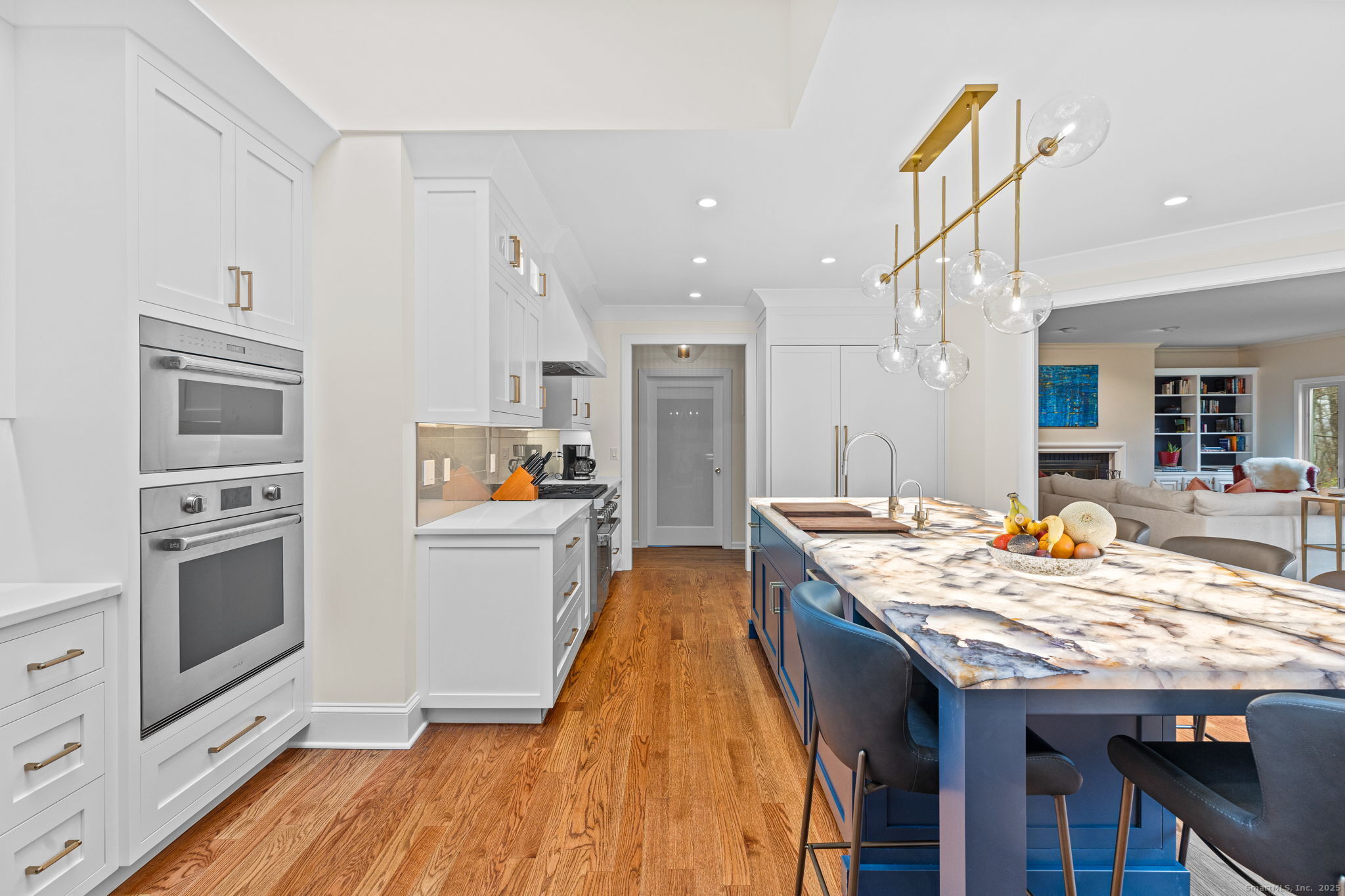 40 Hull Place Ridgefield, CT 06877 - Photo 10 of 40 a kitchen with granite countertop a stove a sink dishwasher and a refrigerator with wooden floor