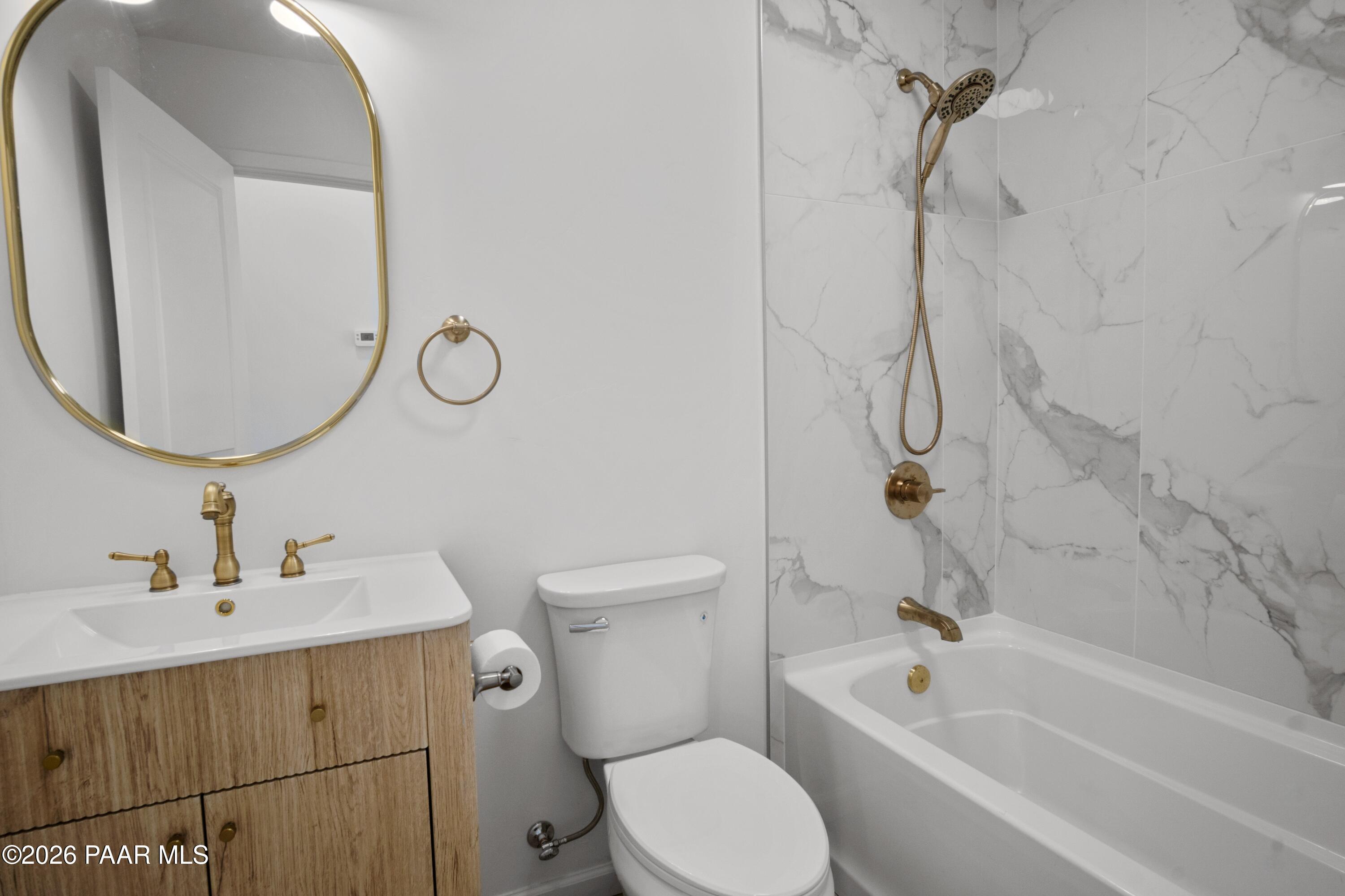 4920 East Amber Road Prescott, AZ 86301 - Photo 31 of 38 a bathroom with a sink a toilet and a mirror