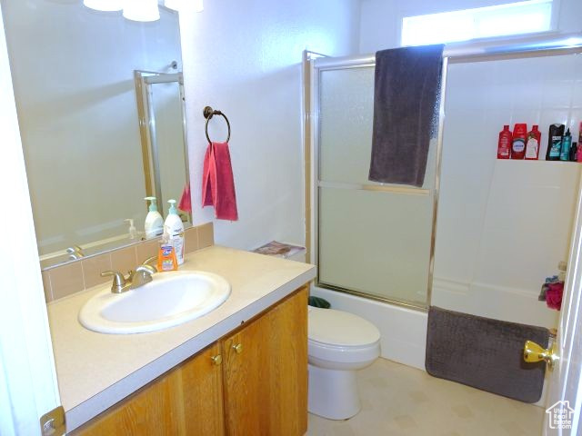 34685 Highway 30 Georgetown, ID 83239 - Photo 7 of 21 Bathroom with toilet, combined bath / shower with glass door, and vanity
