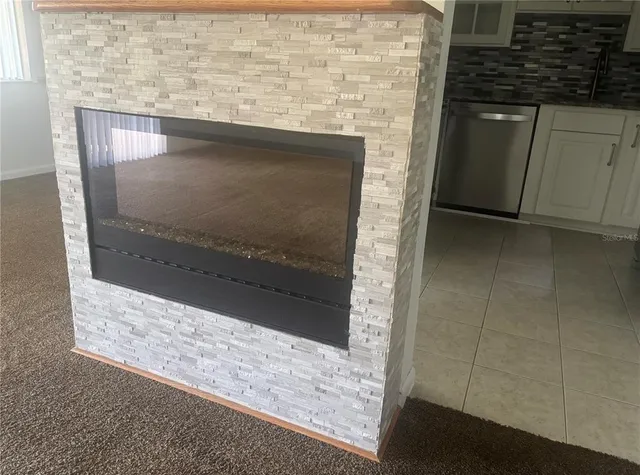 a bathroom with a granite countertop sink