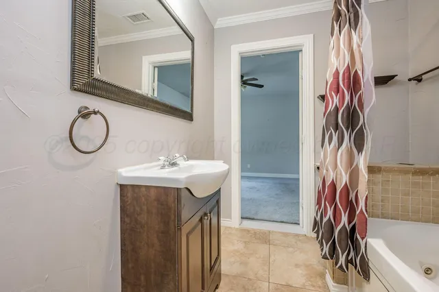 a bathroom with a sink a vanity and a mirror
