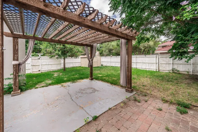 a patio with a yard table and chairs