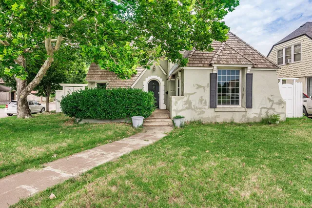 front view of a house with a yard