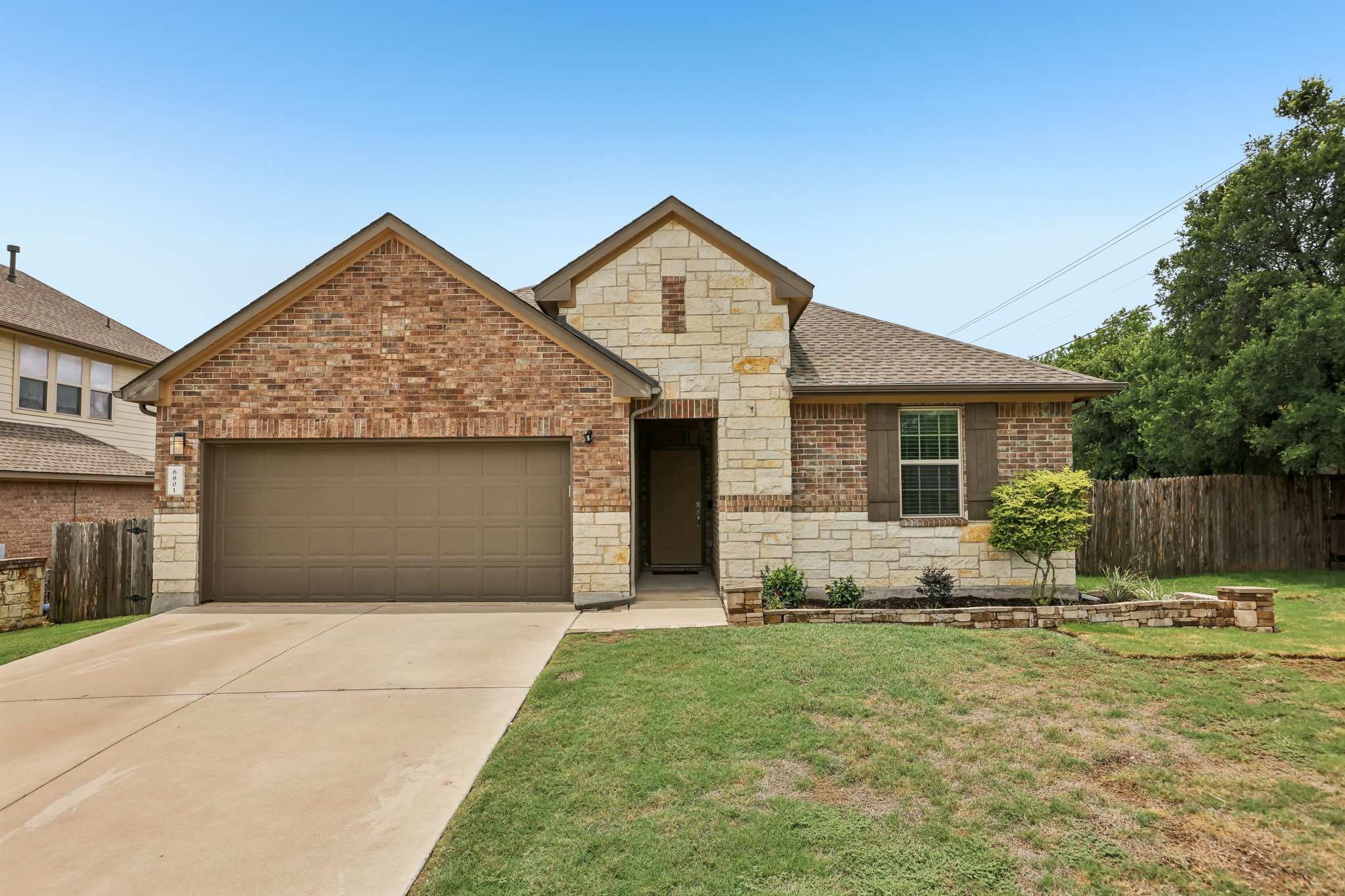 6801 Banff Cove Austin, TX 78754 - Photo 2 of 37 A charming blend of brick and stone accents creates an inviting facade for this home