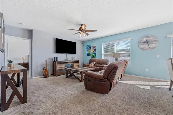 a kitchen with stainless steel appliances granite countertop a sink stove and microwave