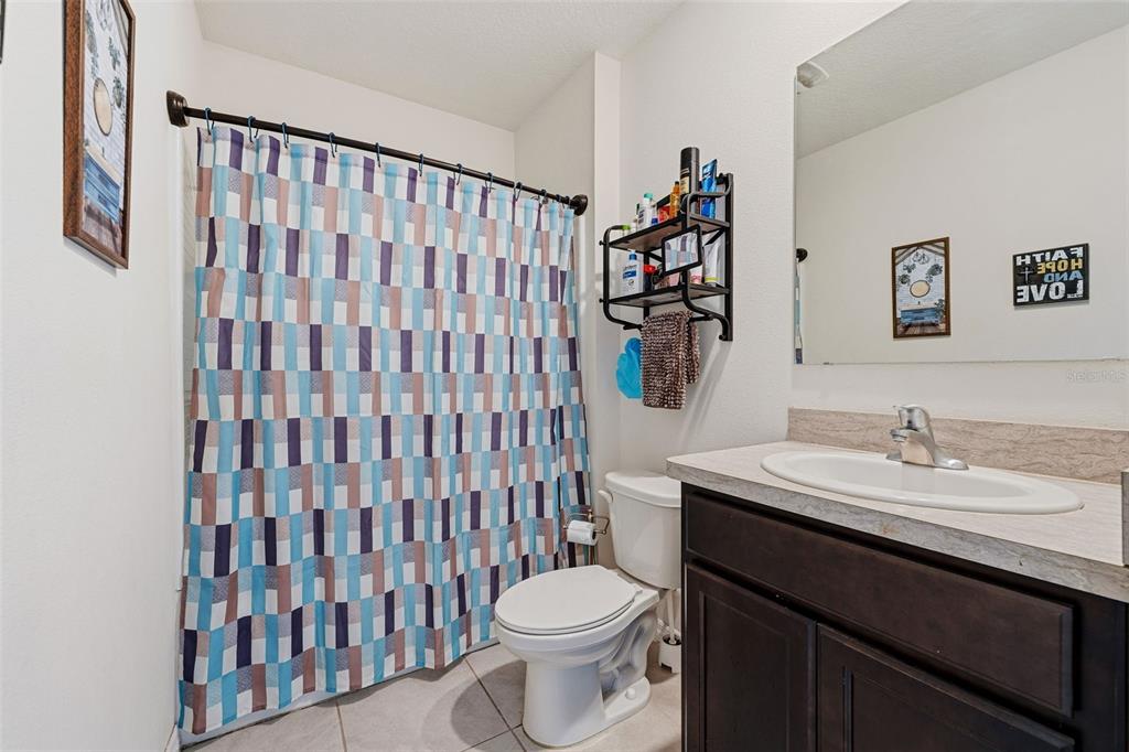 1526 White Hawk Way Groveland, FL 34736 - Photo 26 of 40 a bathroom with a sink toilet and shower