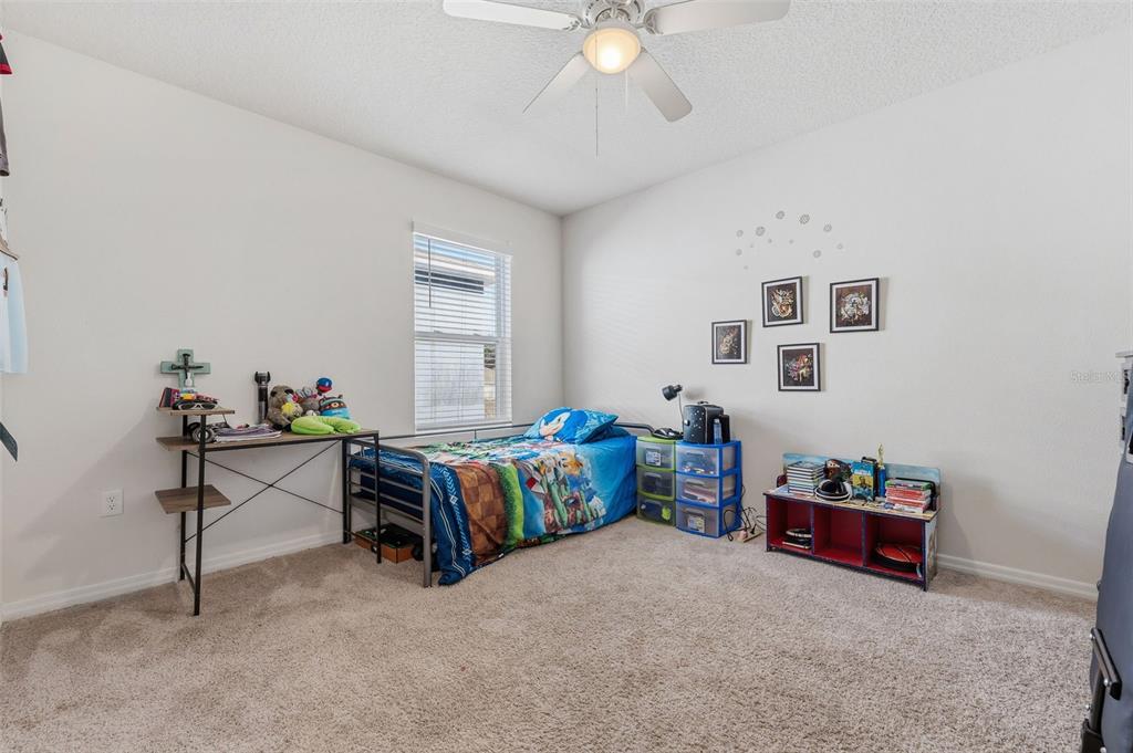 1526 White Hawk Way Groveland, FL 34736 - Photo 29 of 40 a living room with furniture and a table