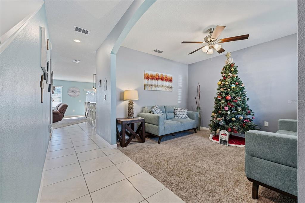 1526 White Hawk Way Groveland, FL 34736 - Photo 9 of 40 a living room with furniture and a christmas tree