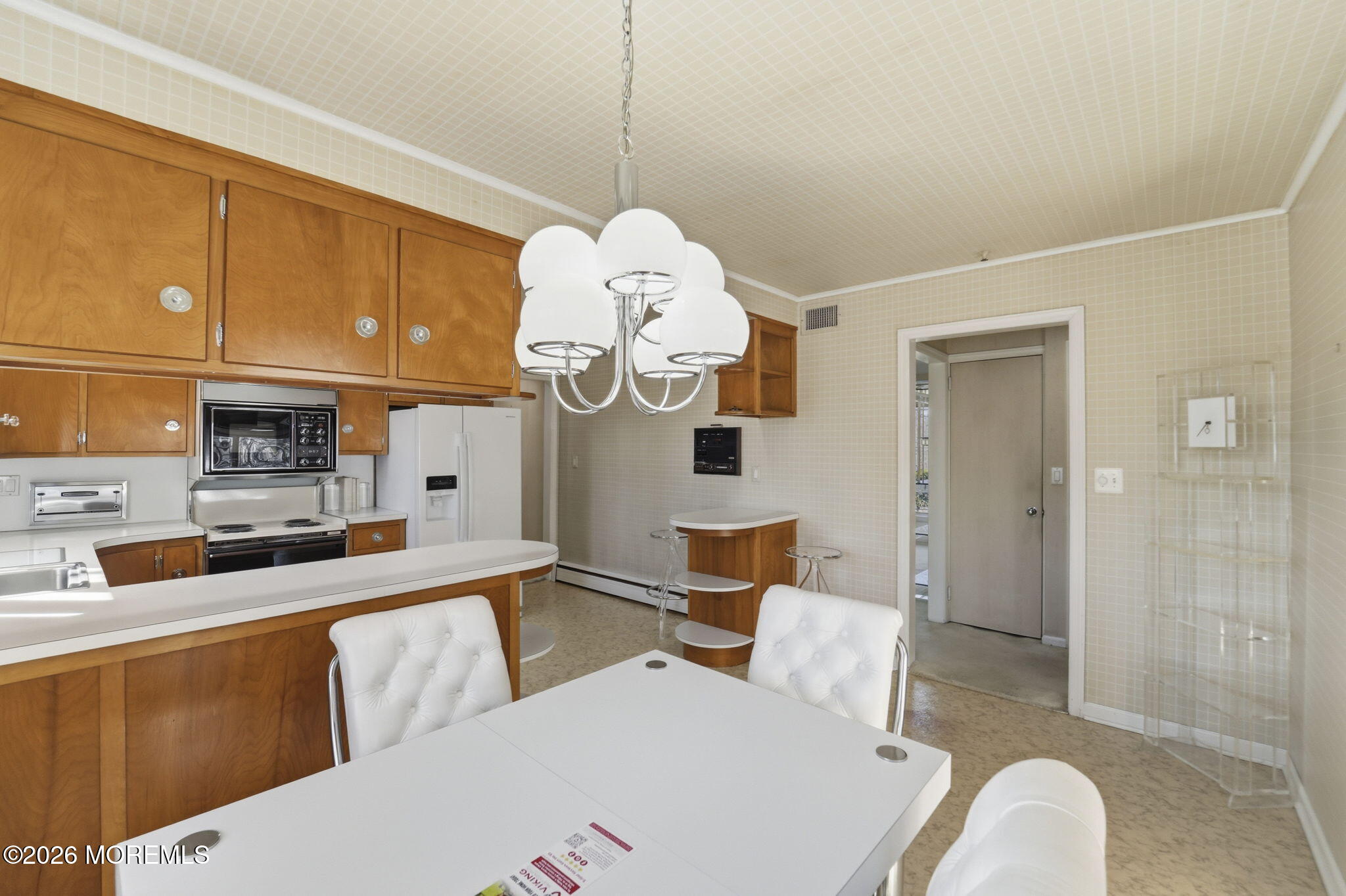 440 Broadway Road Freehold, NJ 07728 - Photo 16 of 50 a living room with stainless steel appliances furniture a fireplace and a kitchen view