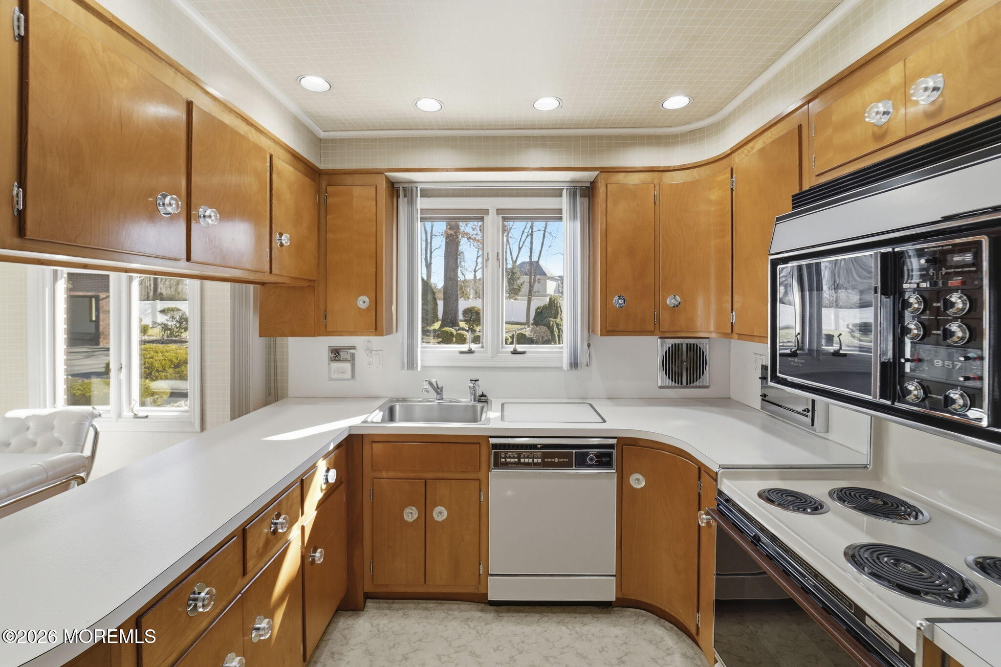 440 Broadway Road Freehold, NJ 07728 - Photo 17 of 50 a view of a kitchen with a sink and large window