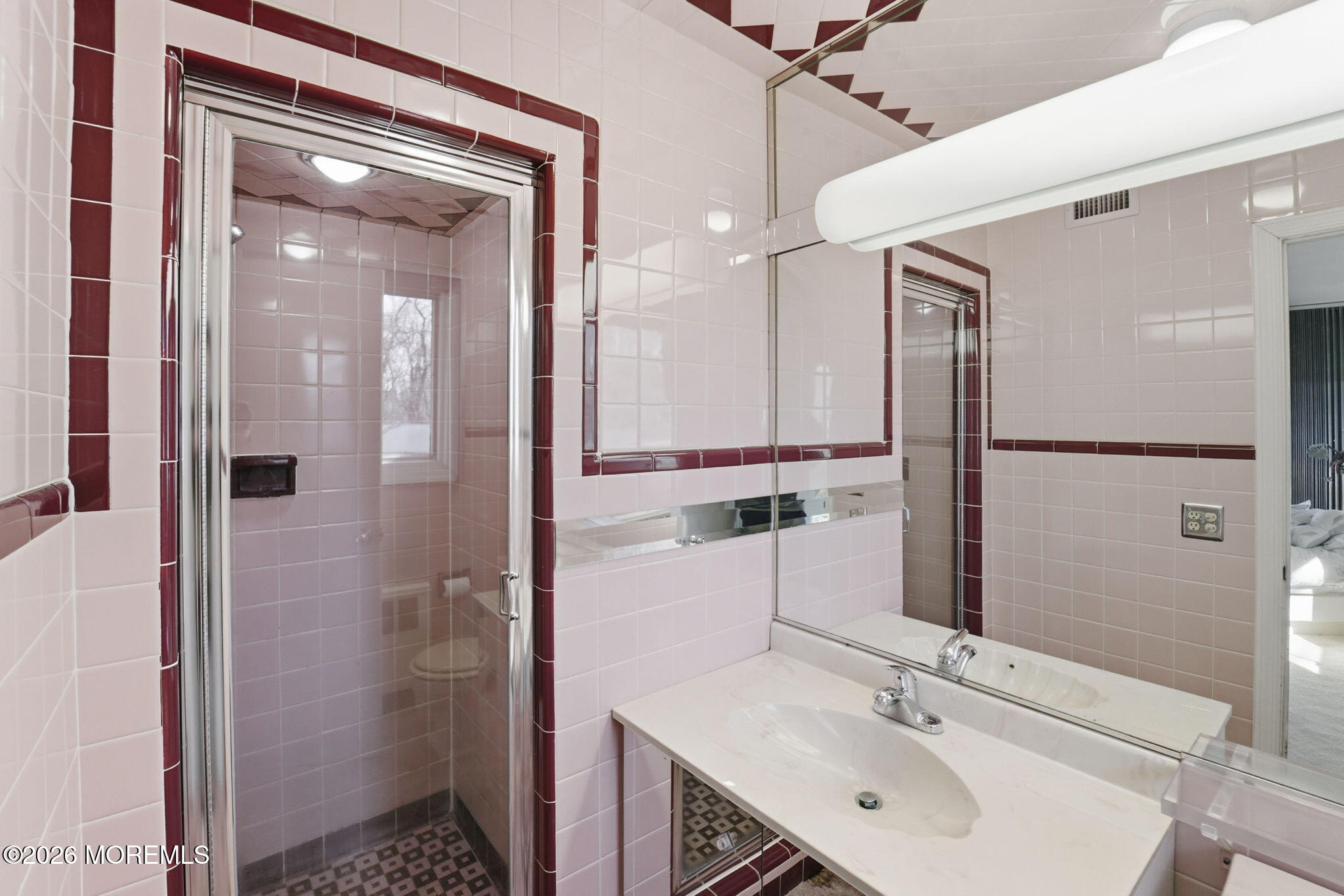 440 Broadway Road Freehold, NJ 07728 - Photo 35 of 50 a bathroom with a sink shower and a mirror
