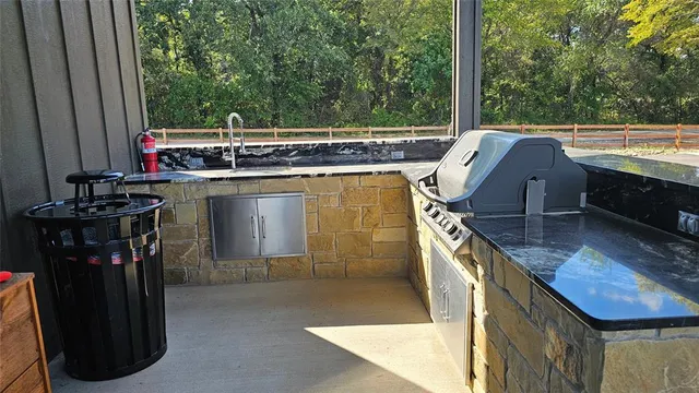 a dining room with furniture and a floor to ceiling window