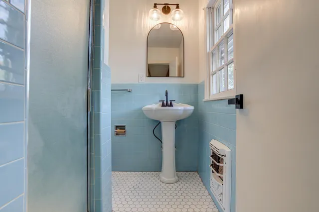 a bathroom with a sink and a mirror