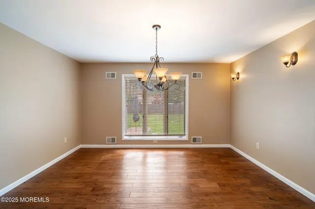 a kitchen with a stove a refrigerator and a sink