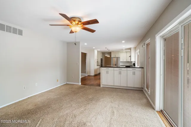 a view of a livingroom with a flat screen tv