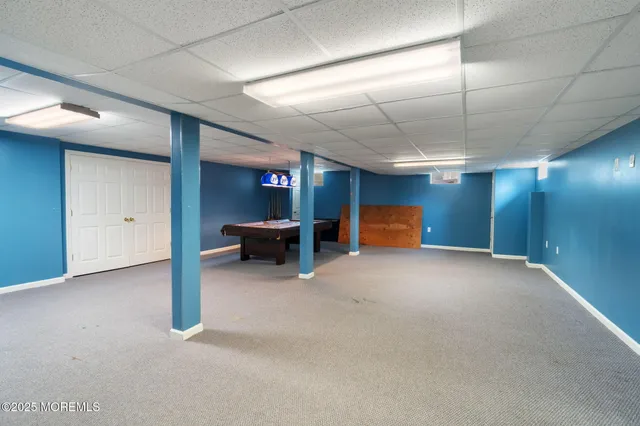 a aerial view of a house with table and chairs in patio