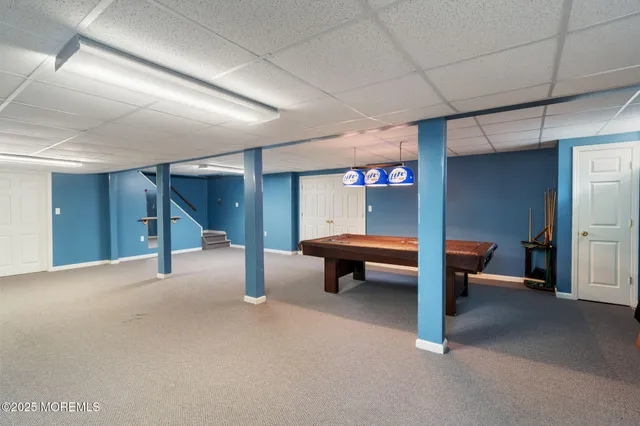 a aerial view of a house with a yard and garage
