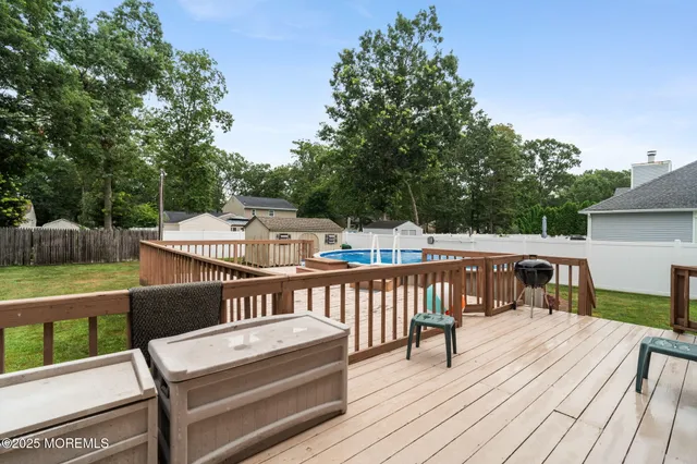 an aerial view of house with yard swimming pool and outdoor seating