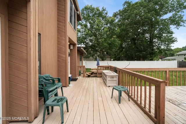 an aerial view of house with yard swimming pool and outdoor seating