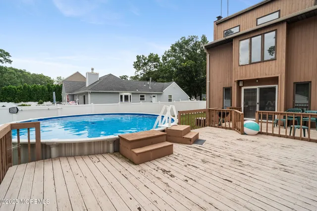 an aerial view of a house with yard swimming pool and outdoor seating