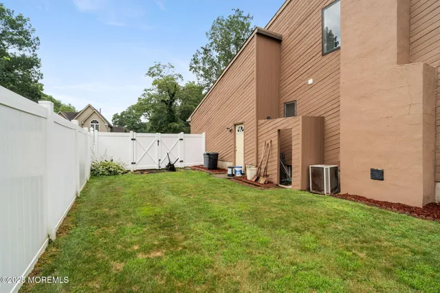 an aerial view of residential house with outdoor space and swimming pool