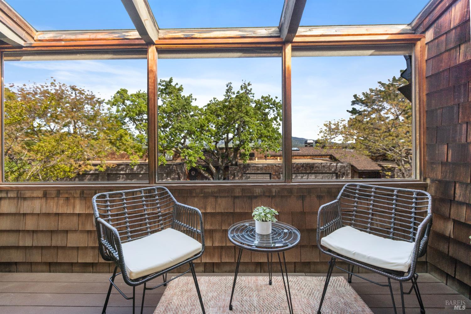 428 El Faisan Drive San Rafael, CA 94903 - Photo 14 of 48 a view of balcony with wooden floor and outdoor seating