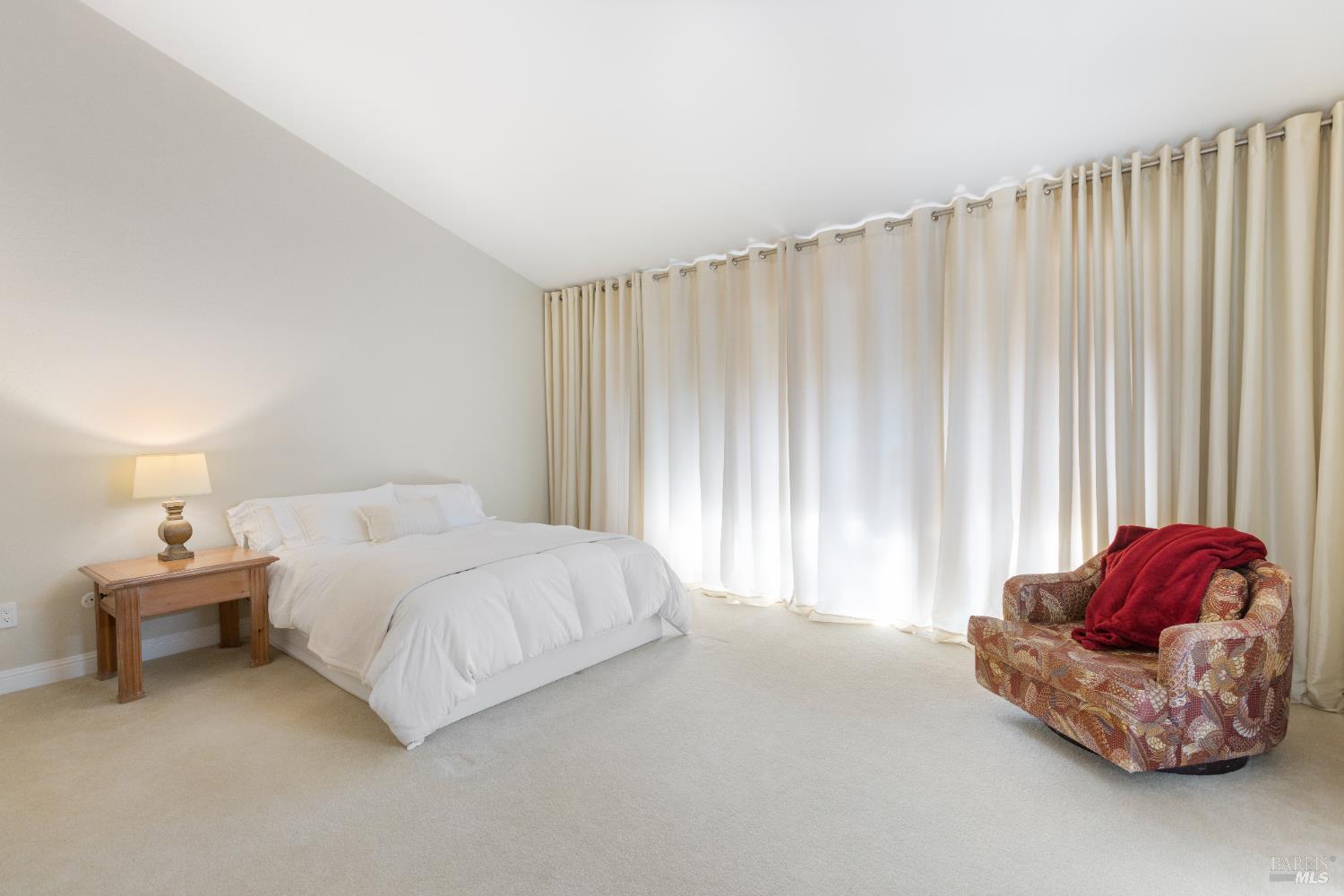 428 El Faisan Drive San Rafael, CA 94903 - Photo 17 of 48 a bedroom with a bed and a couch