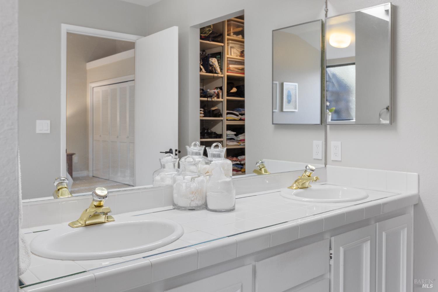 428 El Faisan Drive San Rafael, CA 94903 - Photo 23 of 48 a bathroom with a sink and a mirror
