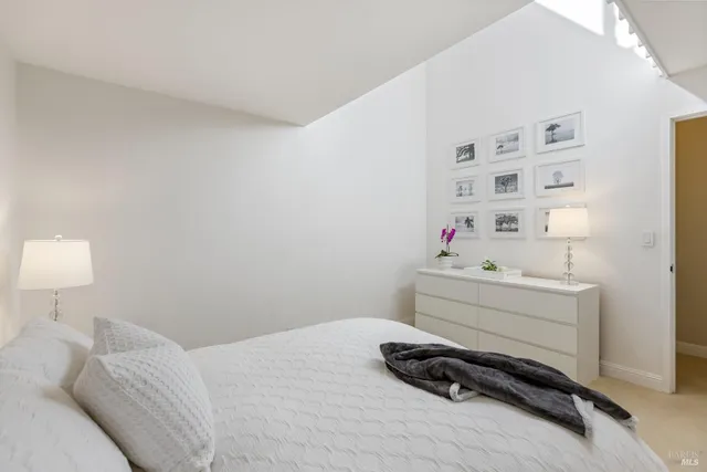 a spacious bathroom with a double vanity sink mirror and toilet