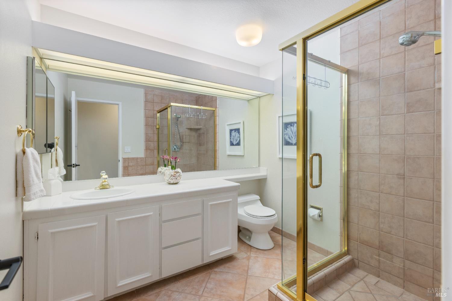 428 El Faisan Drive San Rafael, CA 94903 - Photo 26 of 48 a spacious bathroom with a double vanity sink mirror and toilet