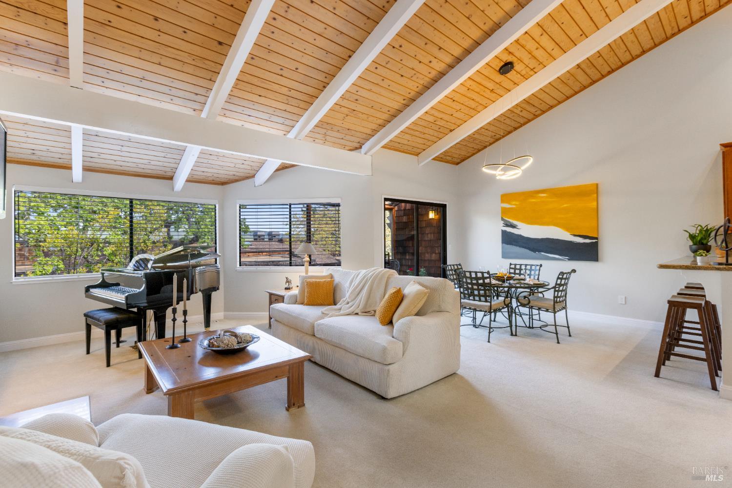 428 El Faisan Drive San Rafael, CA 94903 - Photo 3 of 48 a living room with furniture a fireplace and a large window