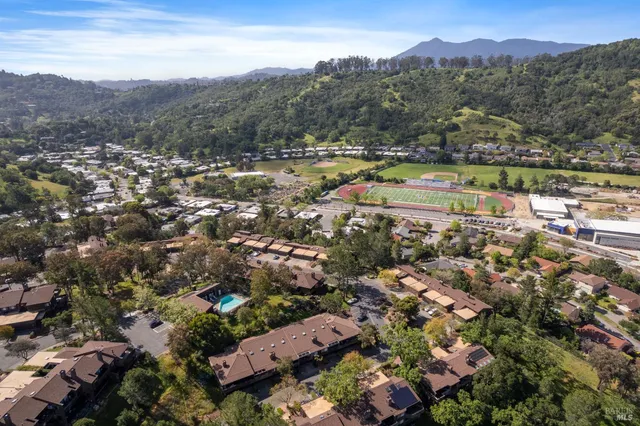 an aerial view of residential house and green space