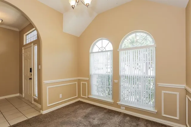 a view of empty room with windows