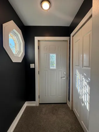 wooden floor in a hall with a window