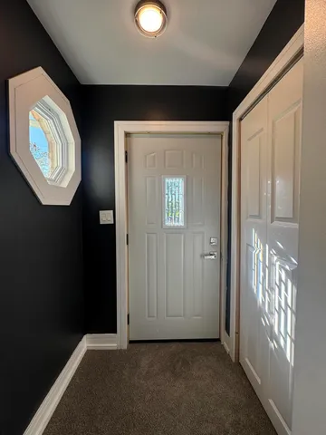 wooden floor in a hall with a window