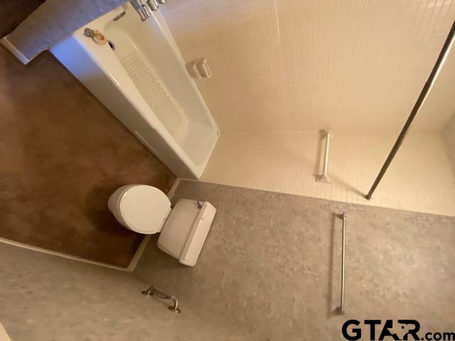 5700 Foxcroft Road Tyler, TX 75703 - Photo 6 of 10 a bathroom with a sink and a mirror