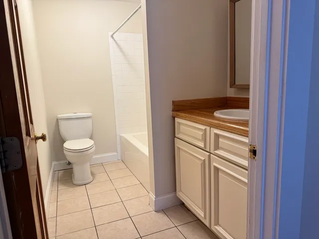 a bathroom with a toilet and a sink