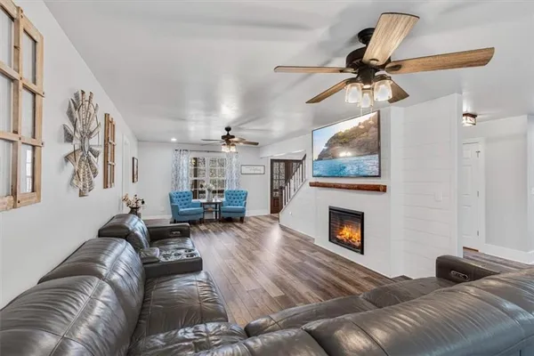 a kitchen with stainless steel appliances kitchen island granite countertop a sink stove and cabinets
