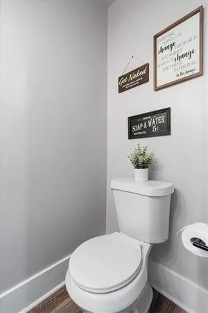 a bathroom with a sink double vanity granite tub shower and a mirror