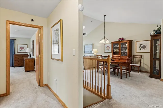 a view of a livingroom with furniture and workspace