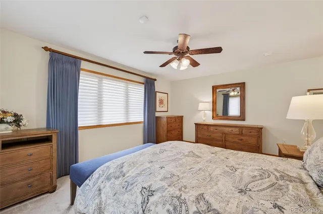 a bedroom with a large bed and a dresser