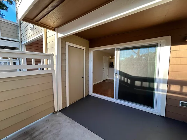 a view of kitchen with furniture and large window