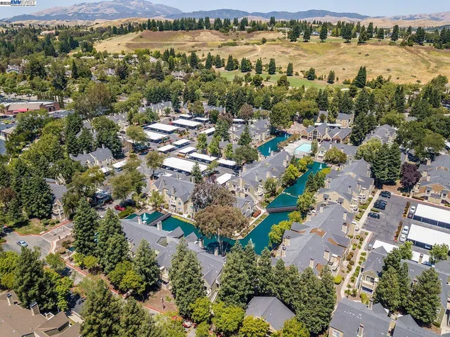 an aerial view of residential house with outdoor space and lake view