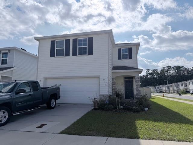 5175 Southwest 47th Lane Gainesville, FL 32608 - Photo 1 of 24 a view of a house with a back yard