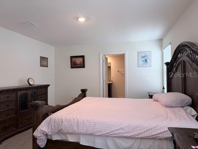 5175 Southwest 47th Lane Gainesville, FL 32608 - Photo 15 of 24 a bedroom with a bed and a dresser