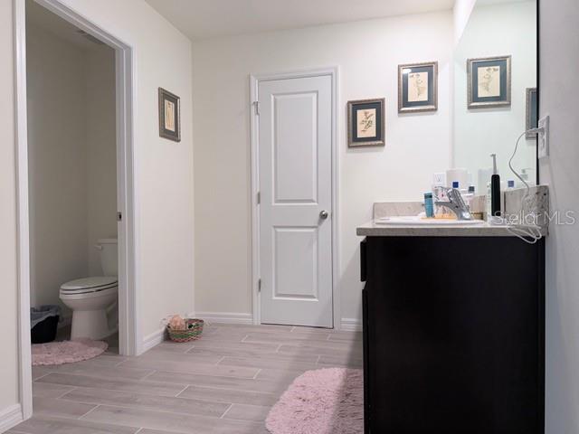 5175 Southwest 47th Lane Gainesville, FL 32608 - Photo 18 of 24 a bathroom with a sink and a toilet